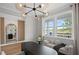 Bright office features modern lighting, neutral decor, and a window offering views of the outdoors at 126 Kenney Way, Locust Grove, GA 30248