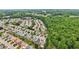 An aerial view of a meticulously planned neighborhood with houses next to a green space at 1620 Diplomat Dr, Cumming, GA 30041