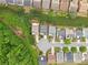 A bird's eye view captures the layout of homes within a vibrant, green community at 1620 Diplomat Dr, Cumming, GA 30041