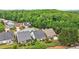 Aerial view highlighting neighborhood homes, rooflines, and abundant greenery, creating a serene community at 1620 Diplomat Dr, Cumming, GA 30041