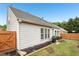 A well-maintained backyard with a fenced perimeter, a grill, and a manicured lawn at 1620 Diplomat Dr, Cumming, GA 30041