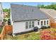 Backyard features a well-maintained lawn, patio and grill, perfect for entertaining at 1620 Diplomat Dr, Cumming, GA 30041