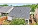 Backyard of home featuring lush green trees and manicured landscaping at 1620 Diplomat Dr, Cumming, GA 30041