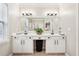 Bright bathroom features a double sink vanity and an extra wide mirror at 1620 Diplomat Dr, Cumming, GA 30041