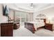 Bedroom featuring tray ceiling, sitting area, and large windows at 1620 Diplomat Dr, Cumming, GA 30041