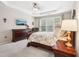 Bedroom featuring tray ceiling, sitting area, and large windows at 1620 Diplomat Dr, Cumming, GA 30041