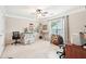 Spacious bedroom features neutral tones, a ceiling fan and a large window at 1620 Diplomat Dr, Cumming, GA 30041