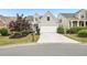 Traditional home showcasing a well-maintained lawn, driveway and neat landscaping at 1620 Diplomat Dr, Cumming, GA 30041