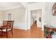 Inviting foyer with hardwood floors and a view of the formal dining area at 1620 Diplomat Dr, Cumming, GA 30041