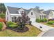 A charming home with an attached garage, manicured landscaping, and great curb appeal at 1620 Diplomat Dr, Cumming, GA 30041