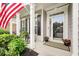 Inviting front porch features columns, rocking chairs and beautiful landscaping at 1620 Diplomat Dr, Cumming, GA 30041