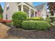 Landscaped front yard of a home with well-maintained bushes and plants at 1620 Diplomat Dr, Cumming, GA 30041