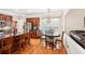Open kitchen nook features a table with seating and a view into the living area at 1620 Diplomat Dr, Cumming, GA 30041