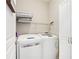 Well-lit laundry room features newer machines and plenty of storage space at 1620 Diplomat Dr, Cumming, GA 30041