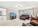 Comfortable living space featuring large windows, TV, sofa, and additional seating at 1620 Diplomat Dr, Cumming, GA 30041