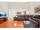 Cozy living room with hardwood floors and an open view to the kitchen creates a welcoming atmosphere at 1620 Diplomat Dr, Cumming, GA 30041