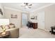 Bright office features neutral tones, a ceiling fan and a large window at 1620 Diplomat Dr, Cumming, GA 30041