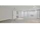 Finished basement area with neutral paint, grey carpet, recessed lights, white doors, and built in shelving at 2305 Lochinver Sw Ln, Conyers, GA 30094