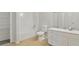 Neutral bathroom with white vanity, tile accent backsplash, shower/tub, and extra shelving unit at 2305 Lochinver Sw Ln, Conyers, GA 30094