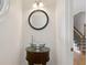 Stylish powder room features glass bowl sink, decorative mirror and lighting at 2305 Lochinver Sw Ln, Conyers, GA 30094