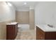 Modest bathroom showcasing tile floors and double vanities at 2305 Lochinver Sw Ln, Conyers, GA 30094