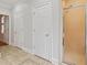 Hallway view of bathroom with tiled floor and shower behind glass door at 2305 Lochinver Sw Ln, Conyers, GA 30094