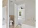 Open bathroom with bathtub and vanity featuring neutral paint and tile at 2305 Lochinver Sw Ln, Conyers, GA 30094