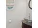 Stylish powder room features glass bowl sink, decorative mirror and lighting at 2305 Lochinver Sw Ln, Conyers, GA 30094