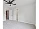 Spacious bedroom boasts neutral paint, plush carpeting, ceiling fan, and ample natural light at 2305 Lochinver Sw Ln, Conyers, GA 30094