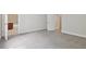 Spacious bedroom featuring neutral paint, grey carpet, and entry to a bathroom with tile flooring at 2305 Lochinver Sw Ln, Conyers, GA 30094