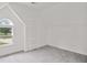 Neutral room with carpet and window to allow for natural light at 2305 Lochinver Sw Ln, Conyers, GA 30094