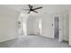 Bedroom featuring neutral paint, carpet, natural light, and ensuite bathroom at 2305 Lochinver Sw Ln, Conyers, GA 30094