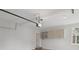 Spacious garage features overhead storage cabinets and automatic door opener at 2305 Lochinver Sw Ln, Conyers, GA 30094