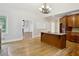Open kitchen and breakfast area boasts hardwood floors and a large center island with granite countertops at 2305 Lochinver Sw Ln, Conyers, GA 30094
