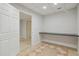 Unadorned room with built-in desk against a wall and open doorway to another room at 2305 Lochinver Sw Ln, Conyers, GA 30094