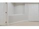 Small room with built-in shelving, a door, and closet with folding doors at 2305 Lochinver Sw Ln, Conyers, GA 30094