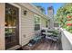 A back deck with a table, chairs, grill, and greenery with view of the backyard at 446 Teal Ct, Roswell, GA 30076