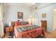 Sun-filled bedroom features a ceiling fan, closet and wall art at 446 Teal Ct, Roswell, GA 30076