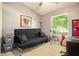 Bedroom with a futon, desk, and a large window with a view of the outdoors at 446 Teal Ct, Roswell, GA 30076