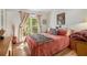 Bright bedroom with natural light, wood flooring and dresser at 446 Teal Ct, Roswell, GA 30076