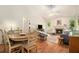 Bright dining area with a round wooden table and chairs, with sight lines into the living room at 446 Teal Ct, Roswell, GA 30076