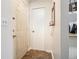 Clean entryway featuring tile flooring and a coat closet for added convenience at 446 Teal Ct, Roswell, GA 30076