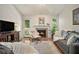 Comfortable living room featuring a decorative fireplace and a door that leads to the outside at 446 Teal Ct, Roswell, GA 30076