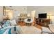 Open-concept living room and dining area with hardwood floors and ample natural light at 446 Teal Ct, Roswell, GA 30076