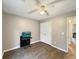 Bedroom featuring hardwood floors, a ceiling fan, and a TV set on a small table at 698 Beranda Cir, Douglasville, GA 30134