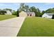 Well-maintained ranch style home with lush green lawn and a long driveway at 698 Beranda Cir, Douglasville, GA 30134