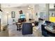 Open living room with vaulted ceilings and modern decor, flowing into other rooms at 698 Beranda Cir, Douglasville, GA 30134