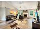 Spacious living room featuring a stone fireplace, vaulted ceilings, and an abundance of natural light at 698 Beranda Cir, Douglasville, GA 30134