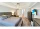 Spacious main bedroom with wood floors, tray ceiling, and ample natural light, creating a relaxing retreat at 698 Beranda Cir, Douglasville, GA 30134