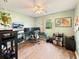 Bright office with a large window, hardwood floors, and multiple computer screens at 698 Beranda Cir, Douglasville, GA 30134